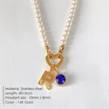 Elegant pearl necklace with 14K gold letter R pendant and blue sparkling crystal - Letter R