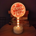 Luce notturna a LED cartello natalizio Santa Stop Here con strisce bianche e rosse - Cartello stradale rotondo / Alimentato a batteria