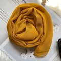 Close-up of lightweight bright yellow silk scarf artistically draped with fashion props - Earthy Yellow / 160x50cm