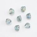 Macro shot of teal faceted crystal glass bell charms for DIY jewelry making and crafts - Transparent Green