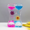 Detail of double heart liquid timer with pink and blue oil drops and rotating wheels - SY01 Colorful Windmill Blue Pink