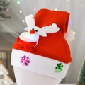 Kids glowing Christmas hat featuring reindeer plush and LED lights on soft red fabric - Kids Glow Reindeer