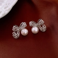 Elegant silver bow earrings with sparkling crystals and a round white pearl drop - Silver Zirconia Bowknot Pearl Stud Earrings (7#)