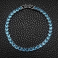 Silver-tone tennis bracelet featuring round cut light blue crystals on black leather - 4mm-16cm / Sky Blue Zirconia