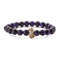 Macro detail of elastic beaded bracelet with violet cat-eye stones and beige bird charm - Purple Tiger Eye