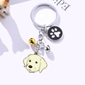 Silver metal keychain featuring a Golden Retriever charm, black paw tag and small bells - Light Labrador (Light Labrador Paw)