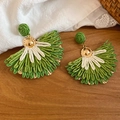 Close-up detail of handcrafted green and white raffia fan-shaped earrings on wooden surface - Bohemian Woven Feather Stud Earrings (64#) / Green