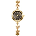 Macro detail of gold watch band featuring clover-shaped rhinestones and grey dial face - Gold Color Black