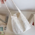 Detailed embroidery texture and magnetic clasp on an ivory minimalist shoulder bag - Creamy White Large Flower Embroidery