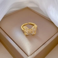Adjustable gold butterfly ring with white cubic zirconia on beige satin jewelry box - Adjustable Open / Butterfly Style (J0085) / Gold