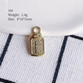 Macro view of gold rectangular jewelry pendant with 12 sparkling crystals and dimensions - 18# (Small Lock)
