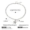Silver stainless steel bracelet with starfish charm and pearl pendant on white backdrop - Silver JDNW2403077-S