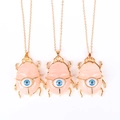 Collier pendentif scarabée en cristal rose avec détail oeil bleu sur chaîne dorée - Quartz Rose (Sans Chaîne)