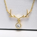 Elegant gold reindeer antler necklace with a sparkling round zircon stone pendant - Gold