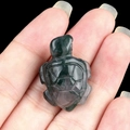 Mini sea turtle figurine carved from natural moss agate with deep green marbled patterns - India Agate