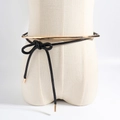 Black waxed cord waist chain with gold metal rings and knotted detail on mannequin - Black Gold