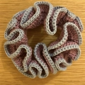 Handmade crochet ruffled scrunchie in dusty purple and grey tones on wooden base - Grey Red Brown