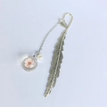 Silver metal feather bookmark featuring a white pearl and pink dried flower glass pendant - Pink Peach Blossom Special