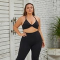 Plus size two-piece black yoga set with twist-front halter top and high-waisted leggings - 16/XXL / Premium Black - Sports Bra