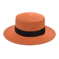Detail of terracotta boater straw hat featuring a fine weave and black ribbon band - M (56-58cm) / Caramel color