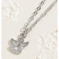 Macro view of silver angel pendant necklace with sparkling cubic zirconia on link chain - Angel / Silver