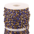 Golden stainless steel chain with blue enamel oval beads on a white plastic spool - Gold-Dark Blue