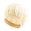 Detail of wide elastic band and silky satin texture on this waterproof yellow hair bonnet - One Size / Beige