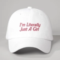 Detailed close-up of pink I'm Literally Just A Girl embroidery on white cotton baseball cap - Adjustable / White