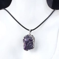 Natural raw amethyst pendant necklace with silver edges and black cord on a white bust - Amethyst (Silver)
