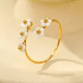 Detailed view of 18K gold titanium steel ring with white flower petals and zircon insets - One Size (Adjustable Open) / Five White Flowers Design