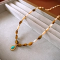 Detail of beaded necklace with tiger eye stones and vintage gold turquoise pendant - Teardrop Pendant / Brown / Turquoise