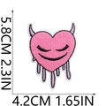 Detailed view of pink heart embroidery patch with purple horns and 5.8x4.2cm size marks - No.18 Pink Dripping Heart