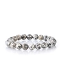 Macro shot of natural Dalmatian Stone beaded bracelet with polished black spotted texture - 2202 Black & White Sesame Stone