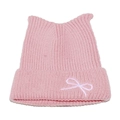Close-up of pink knitted hat with cat ears and delicate embroidered bow details - M (56-58cm) / Pink