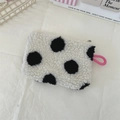 Detailed close-up of plush polka dot coin purse in cream white with soft lamb wool texture - White Background Polka Dots