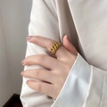 Detail of a gold wide link chain ring with watch band style on a model finger - US 6 / Watch Band Style
