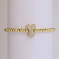 Gold-plated beaded bracelet featuring a sparkling bone-shaped zircon pavé charm - Letter Y