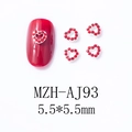 Macro view of 5.5mm red heart nail gems with silver base and hollow center design - Hollow Heart Style (AJ93)