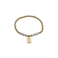 Detail of gold beaded bracelet with white pearls and a rectangular R letter charm - Letter R