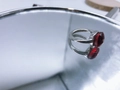 Silver stainless steel ring with a large faceted red gemstone and reflective finish - Silver Base: Jan-Red