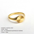 Detailed macro view of 9mm wide gold stainless steel ring with radial sunray texture - US 5 / Gold