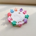 Detailed set of 10 mini flower hair claws in macaron matte colors on white card - Flower