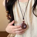 Macro view of vintage fabric print heart pendant necklace with intricate woven cord details - 16# Coffee Safety Buckle Style