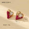 Macro shot of 18K gold plated heart stud earrings with magenta enamel and zircon - Rose Red