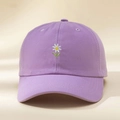 Close-up of embroidered white daisy on a light purple cotton baseball cap for summer - Purple