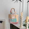 Detailed view of colorful striped canvas handbag with Sazakka brand label in home setting - Handbag Style