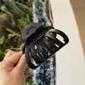Detail view of large matte black hair claw clip with sturdy resin teeth for thick hair - Matte Black