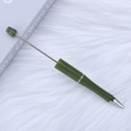 Olive green DIY beaded pen with metallic accents displayed on a white textured background - Ripple Green