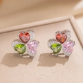 Macro shot of clover earrings with red, pink, and green heart-shaped cubic zirconia - Silver Stud Earrings