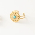 Detailed macro view of vintage gold ring with turquoise stone and hollow pattern - Adjustable Open / Round Lake Blue